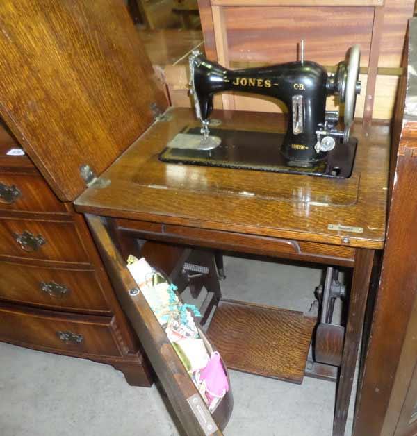 jones sewing machine in cabinet